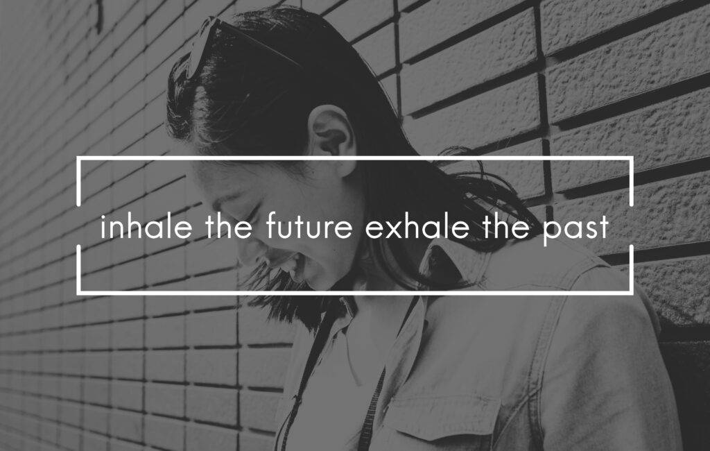black and white picture of a girl portrait with an overlay text "inhale the future exhale the past" about return to normal life